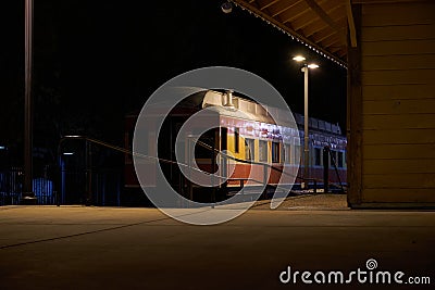 Downtown Folsom, CA, Sutter Street with a train at night Stock Photo