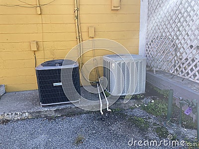 Downtown Lakeland Florida air conditioner units yellow brick wall Editorial Stock Photo