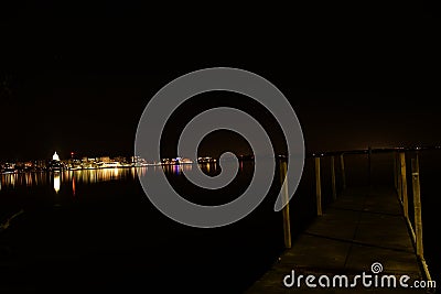 Downtown Madison at night from Olin Park boat ramp pier on lake Mendota Stock Photo