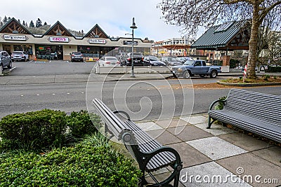 Downtown Mercer Island, benches and plants in sidewalk, strip mall with small businesse Editorial Stock Photo