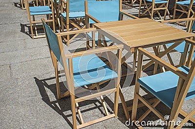 Downtown restaurant terrace with folding canvas chairs Stock Photo