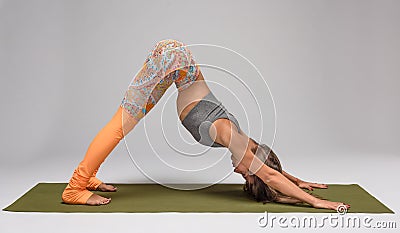 Downward facing dog pose Stock Photo