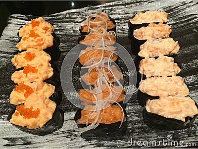 A dozen of 3 kinds Gunkan salmon sushi Stock Photo