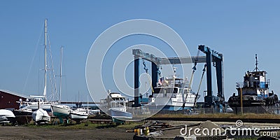 Boat yard outside, many small white boats in for repair or sale Stock Photo