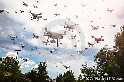 Dozens of Drones Swarm in the Cloudy Sky Stock Photo