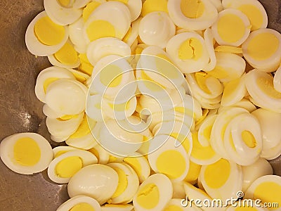 Dozens of sliced eggs for egg salad sandwiches at the soup kitchen, feeding the hungry Stock Photo