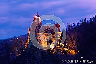 Dracula Castle with lights at night in Romania Stock Photo