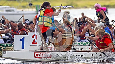 Dragon boat drummer leads team Editorial Stock Photo