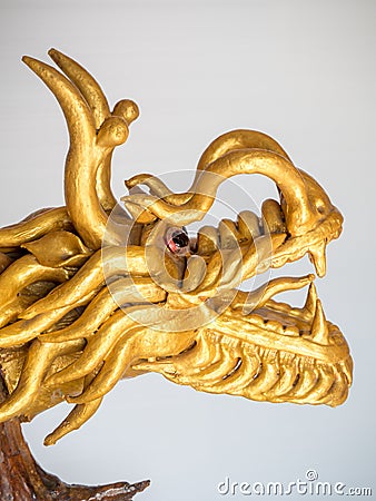 The dragon Chinese color gold made from wood photo Stock Photo