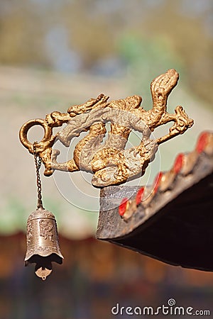 Dragon figure with bell as decoration of Taoist temple, Beijing, China Stock Photo