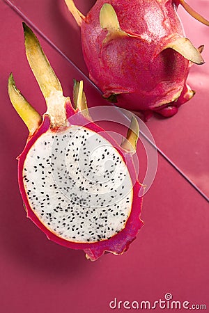 Dragon fruit half on birght pink background Stock Photo