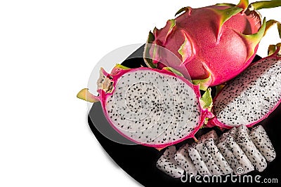 Dragon fruits healthy food in black dish on white Stock Photo