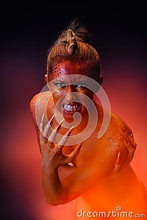 Dragon girl with creative bodyart Stock Photo