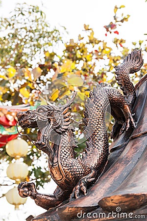 Dragon hold the ball at a temple Stock Photo