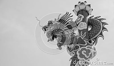 Dragon involve a pillar in background Stock Photo