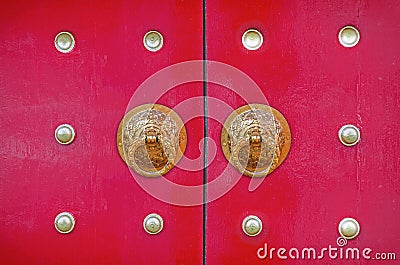 dragon knocker on the chinese red door Stock Photo