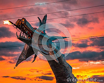 Dragon sculpture breathing fire at sunset at Artprize 9 in Grand Rapids Michigan Editorial Stock Photo