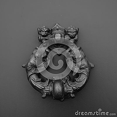 A dragon-shaped knocker, Italy Stock Photo