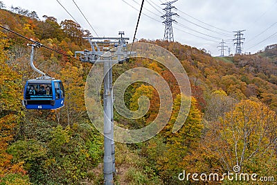 Dragondola (Naeba-Tashiro Gondola) in autumn foliage season. The longest aerial gondola lift line Japan. Editorial Stock Photo