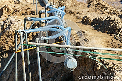 drainage system for pumping out groundwater out of the ground. Water pumping station. A set of interconnected pipes for pumping Stock Photo