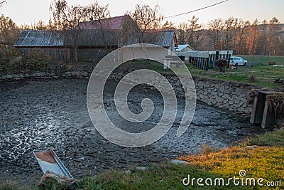 Drained pond full of mud Stock Photo