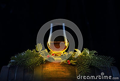 Dram of Whisky in Nosing Glass atop Whisky Cask Stock Photo