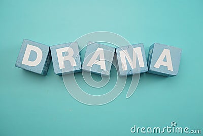 Drama word created with cubes alphabet letters on blue background Stock Photo