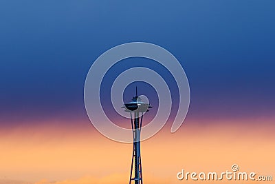 dramatic blue, orange winter sunset behind Space Needle in Seattle Editorial Stock Photo