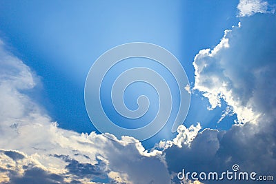 Dramatic blue sky and sunbeams Stock Photo