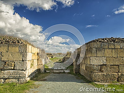 Dramatic blue sky with white clouds over the ruins of the ancient greek colony of Histria, on the shores of Black Sea. Histria is Stock Photo