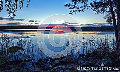 Dramatic clouds over rural lake Stock Photo