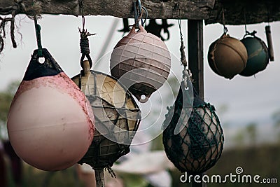 Dramatic colorful fishing floats drying Stock Photo