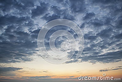 Dramatic dark cloudy sky over sea, natural photo background. Dark storm clouds background Stock Photo