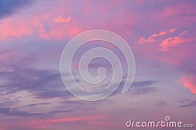 Dramatic fiery sunset sky in a mixture of violet, pink, orange and black colors Stock Photo