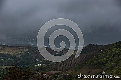 Dramatic foggy landscape image of avocado farm in and mountains in the caribbean campo of Ocoa, dominican republic. Stock Photo