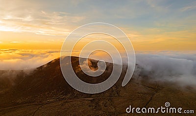 Dramatic high level aerial panoramic view over Calderon Hondo volcanic crater at sunset near Corralejo in Fuerteventura Stock Photo