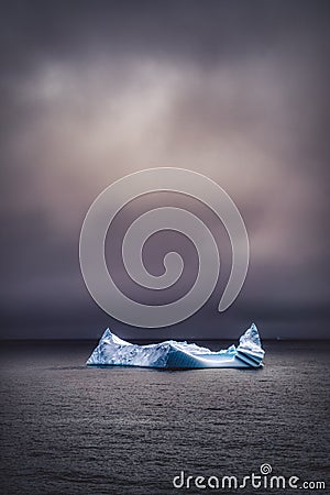 Dramatic image of an iceberg floating Stock Photo