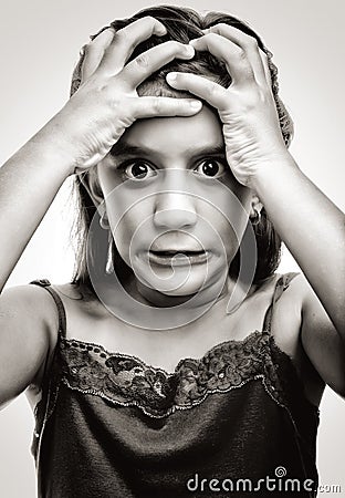 Dramatic image of a latin girl with an angry face Stock Photo