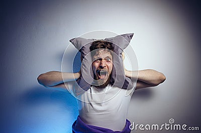 Dramatic image, man can`t sleep from the noise Stock Photo