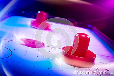 Dramatic lit air hockey table with light trails Stock Photo