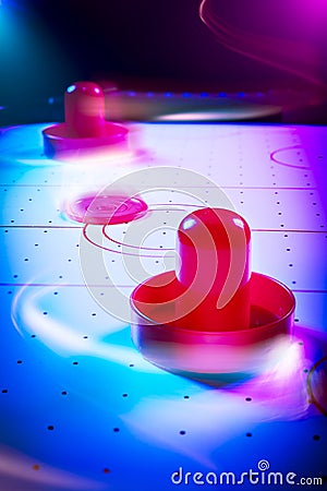 Dramatic lit air hockey table with light trails Stock Photo