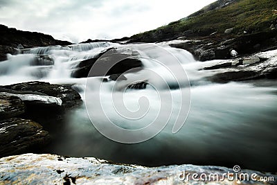 Dramatic long exposure shot of rapids and rocks Stock Photo