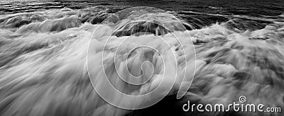 Dramatic long exposure waves in black and white Stock Photo