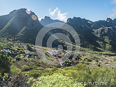 Dramatic lush green picturesque valley with old village Los Carrizales . Landscape with sharp rock formation, hills and Stock Photo