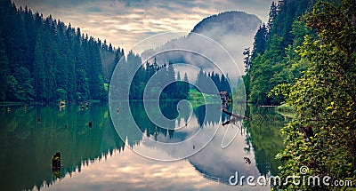 Dramatic morning view of Lacu Rosu lake. Splendid summer scene of Harghita County, Romania, Europe. Stock Photo