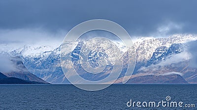 Dramatic Mountains Breaking Through the Coastal Clouds Stock Photo