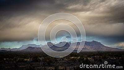 Dramatic Mountains Just Up from the Valley under Thick Clouds Stock Photo