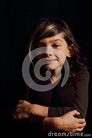 Dramatic portrait of dark haired girl Stock Photo