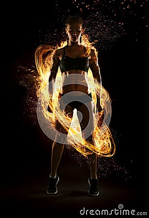 Dramatic portrait of professional bodybuilder. Fire and energy. Stock Photo