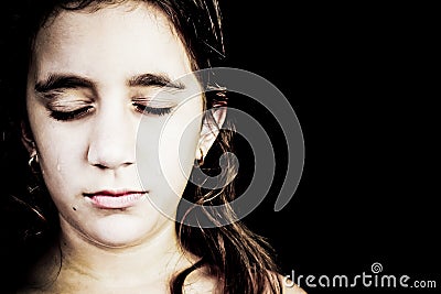 Dramatic portrait of a very sad girl crying Stock Photo